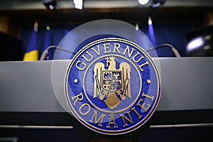 RomaniaÃ¢â¬â¢s emblem with the Romanian government text photo